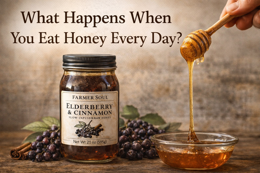 Jar of Farmer Soul elderberry and cinnamon slow-infused raw honey with honey dipper dripping honey on a rustic wooden table.