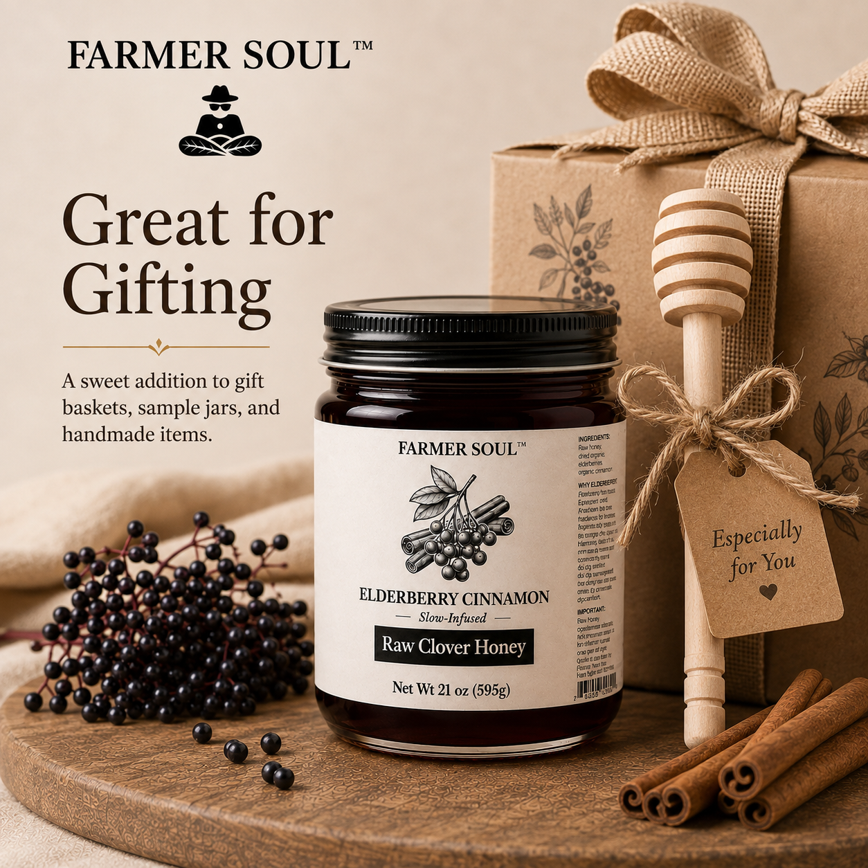 A jar of Farmer Soul Elderberry Cinnamon Raw Clover Honey is styled on a wooden board with cinnamon sticks, elderberries, a wooden honey dipper, and a kraft gift box with a burlap ribbon. Text on the left reads 'Great for Gifting'.